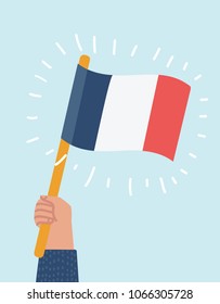 Vector cartoon illustration of France flag in human hand, round icon with shadow isolated on white.