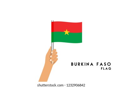 Vector cartoon illustration of human hands hold Burkina Faso flag. Isolated object on white background.