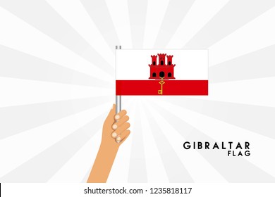 Vector cartoon illustration of human hands hold Gıbraltar flag. Isolated object on white background.