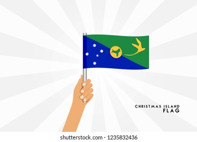 Vector cartoon illustration of human hands hold Christmas İsland flag. Isolated object on white background.