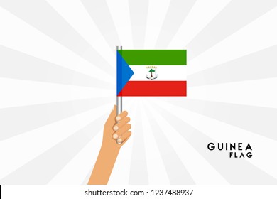 Vector cartoon illustration of human hands hold Guinea flag. Isolated object on white background.