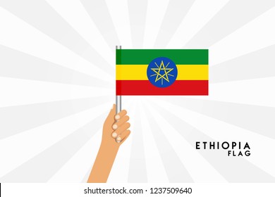 Vector cartoon illustration of human hands hold Ethiopia flag. Isolated object on white background.