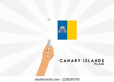 Vector cartoon illustration of human hands hold Canary islands flag. Isolated object on white background.