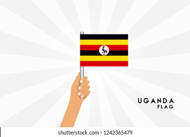 Vector cartoon illustration of human hands Uganda hold  flag. Isolated object on white background.