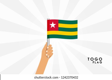 Vector cartoon illustration of human hands hold Togo flag. Isolated object on white background.
