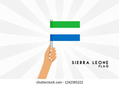 Vector cartoon illustration of human hands hold Sierra Leone flag. Isolated object on white background.