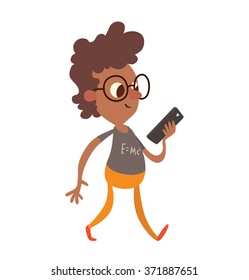 Vector cartoon image of a funny little black boy in glasses with brown curly hair in orange pants and gray jacket walking with black smartphone in his hand on a white background. Vector illustration.