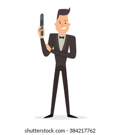 Vector cartoon image of a funny super agent with black hair in a black tuxedo, white shirt and black bow tie with a gray gun in his hand standing and smiling on a white background. Vector illustration
