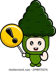 vector cartoon mascot character mascot vegetable broccoli costume holding a warning sign