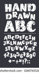 Vector cartoon Sans chalk alphabet withcaps letters. Numbers, several signs symbols. Textured white characters on dark background. Division sign, multiplication, plus, equals