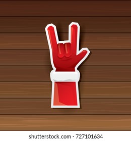 vector cartoon Santa Claus hand rock n roll icon on wooden background. Christmas Rock n roll concert or hipster party poster design template