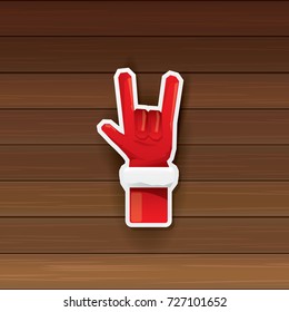 vector cartoon Santa Claus hand rock n roll icon on wooden background. Christmas Rock n roll concert or hipster party poster design template