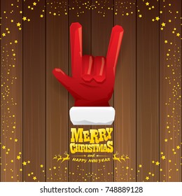 vector cartoon Santa Claus rock n roll style with golden calligraphic greeting text on wooden background with christmas star lights. Merry Christmas Rock n roll party poster design or greeting card. 