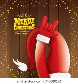 vector cartoon Santa Claus rock n roll style with golden calligraphic greeting text on wooden background with christmas star lights. Merry Christmas Rock n roll party poster design or greeting card. 