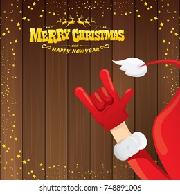 vector cartoon Santa Claus rock n roll style with golden calligraphic greeting text on wooden background with christmas star lights. Merry Christmas Rock n roll party poster design or greeting card. 