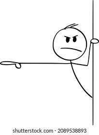 Vector cartoon stick figure drawing conceptual illustration of angry rude man or businessman peeping out from behind wall and showing or pointing finger at something.