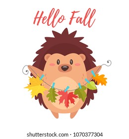 Vector cartoon style illustration of cute hedgehog holding autumn colorful leaves hanging on clothespin. Greeting card template for print. Hello Fall text.