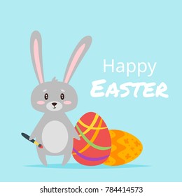 Vector  cartoon style illustration of Easter day greeting card with cute bunny with pain brush and colorful eggs on blue background.