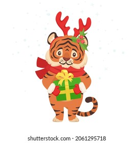 Vector cartoon style illustration of a New Year or Christmas cute tiger holding present in paws. Isolated on white background.