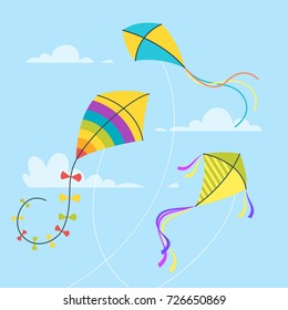 Vector cartoon style set of kites in the sky with clouds. Isolated on blue background.