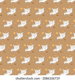 
vector cat eating while playing with ball on brown background