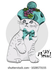Vector cat with  knitted beret and bow. Hand drawn illustration of dressed cat.
