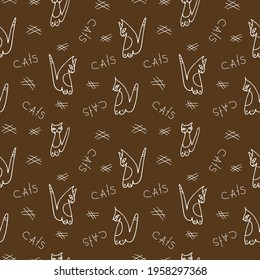 vector cats on a chocolate background