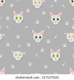 Vector cats seamless pattern. Repeating cat background of cat's faces, paws and fishbones on gray.  