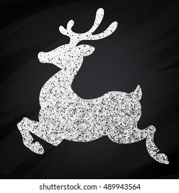 Vector chalk drawn christmas deer silhouette on chalkboard