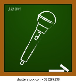 Vector chalk drawn doodle hand microphone icon on school board 