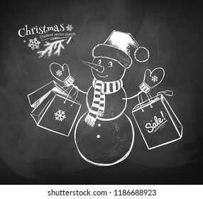Vector chalk drawn illustration of cute Snowman character wearing Santa hat with shopping bags on chalkboard background.
