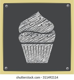 Vector chalk drawn sketch of cupcake icon on school blackboard  