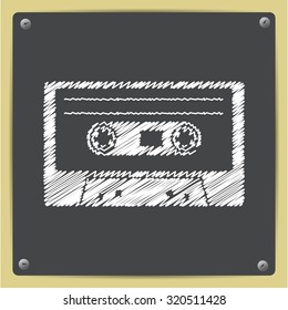 Vector chalk drawn in sketch style retro cassette icon on school blackboard 