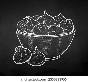 Vector chalk drawn sketchy illustration of meringue cookies on chalkboard background