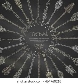 Vector chalk hand-drawn tribal arrows round frame on blackboard background. Boho and hippie style illustration.