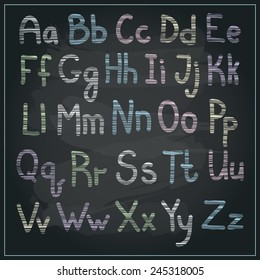 Vector chalk sketched pastel colors alphabet on a blackboard background