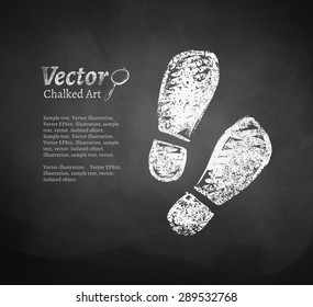 Vector chalkboard drawing of footprints.