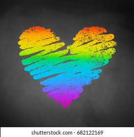 Vector chalked sketch of rainbow colored heart on blackboard background.