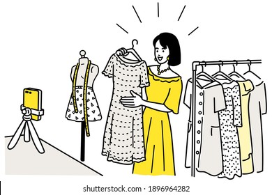Vector character of pretty woman showing and selling her clothes with vlog video live streaming online via her smartphone. Outline, linear, thin line art, hand drawn sketch design, simple style.