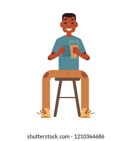 Vector cheerful man sitting at chair at pub, bar or cafe holding glass of beer raising hand up watching football match rooting for the team. Isolated illustration