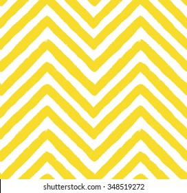 Vector chevron seamless pattern. Textured grunge geometric background for wallpaper, gift paper, fabric print, furniture. Zigzag print. Unusual painted ornament from brush strokes. Yellow and white