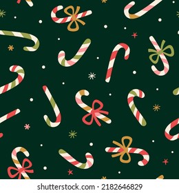 Vector Christamas seamless pattern with Candy Canes. Holiday repeated texture with traditional Christmas sweets. Winter print for fabric and wrapping paper.