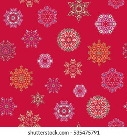 Vector christmas abstract design on red background with falling snowflakes. Snowflakes pattern.