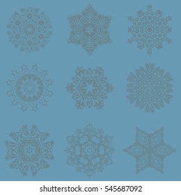 Vector Christmas Abstract Stylized Snowflakes Set on a blue Background.