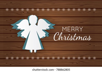 Vector christmas angel. Paper carving silhouette. Happy new year card. Hand-made toy on wooden background.Paper christmas symbol and icon. Decoration design.Festive template.Mock-up for your design