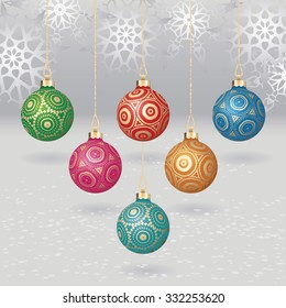 Vector christmas balls with gold design on light background with flakes