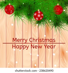 Vector Christmas card with Christmas balls on  Christmas tree on wooden background. Eps10