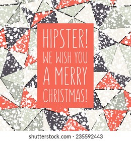 Vector Christmas card with trendy triangles. At the base it has a geometric seamless pattern with chaotic speckled covering. Graphical colorful background. Wishes are adressed to hipsters.