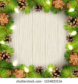 Vector Christmas frame with green fir tree branches, lights and cones on a wooden background.
