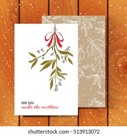 Vector Christmas greeting card design with hand drawn mistletoe and text . Perfect holiday card on wooden backdrop. Romantic Christmas illustration. Vector mistletoe. 